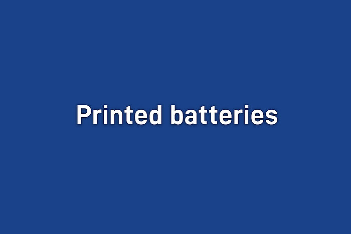 White bold text reading Printed batteries centered on a solid blue background