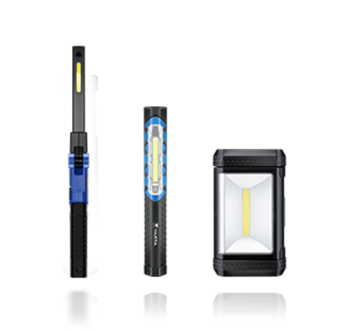 Three black LED work lights of varying sizes with blue accents and white light strips on a plain background