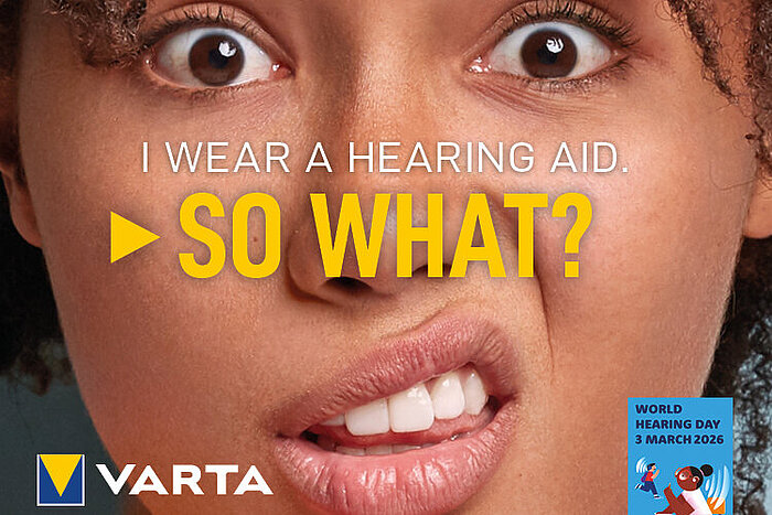 Close-up of woman's face with text I wear a hearing aid. So what?, VARTA logo, World Hearing Day 3 March 2026