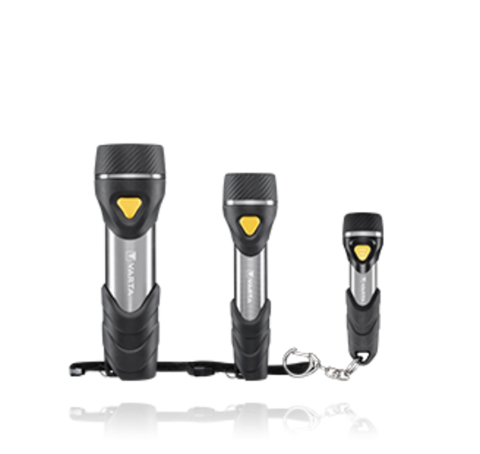 Three Varta flashlights in different sizes with black grips, silver bodies, and yellow power buttons, one with wrist strap