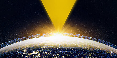 Earth from space with glowing blue network grid, bright yellow light beam shining down from above against starry sky