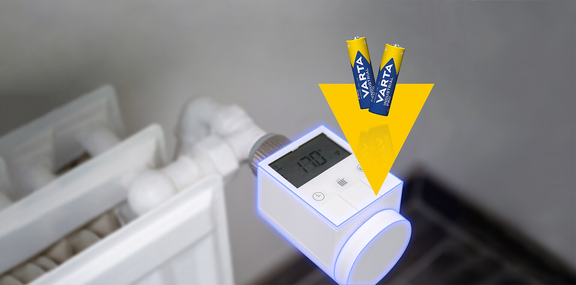 Smart radiator thermostat with digital display, yellow arrow and two Varta batteries indicating battery replacement