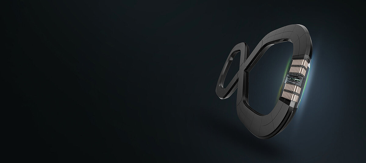 Stylized infinity-shaped device with dark metallic casing and exposed copper coil components on dark background